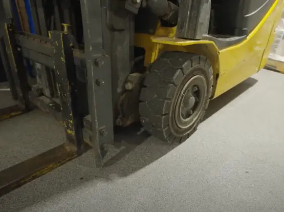 Heavy forklift operating on durable industrial floor coating